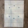 Copertina in filo con ricamo azzurro e tortora - Marlù